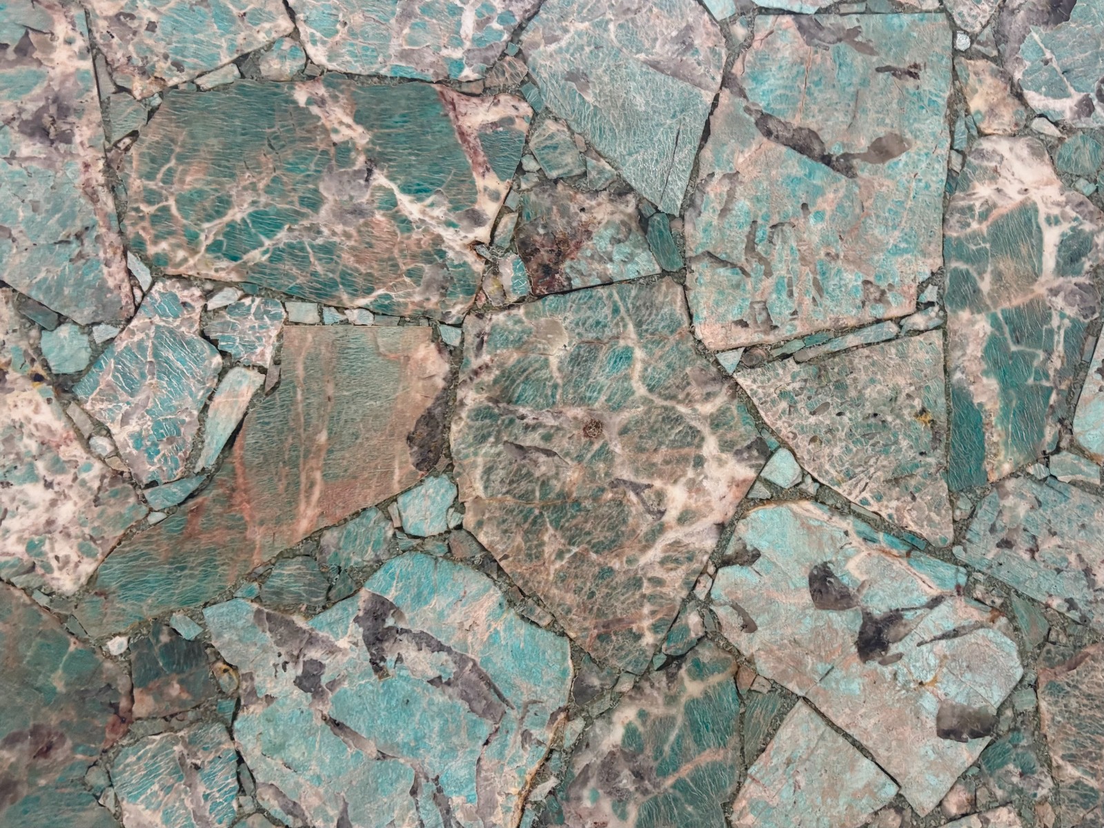 Explore Amazonita Granite slabs in vivid green, turquoise, and blue-green tones for luxury countertops, waterfall islands, feature walls, and custom stone projects.